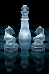 Image showing Macro shot of glass chess pieces against a black background