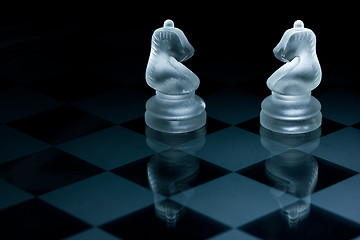 Image showing Macro shot of glass chess pieces against a black background