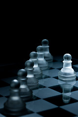 Image showing Macro shot of glass chess pieces against a black background