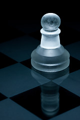 Image showing Macro shot of glass chess pawn against a black background