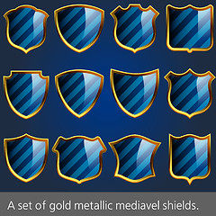 Image showing A set of gold metallic mediavel shields.