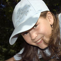 Image showing The smiling girl in a cap