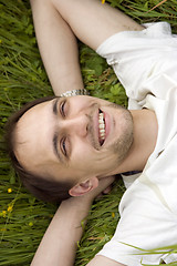 Image showing The man having a rest on a grass