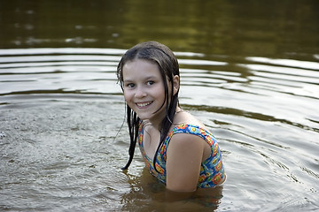 Image showing The girl bathes in lake