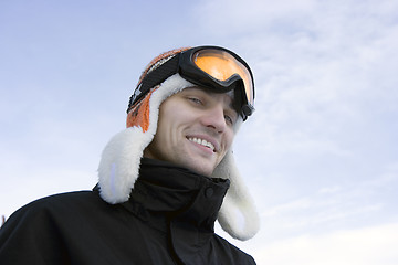 Image showing young man in ski glasses and a winter cap