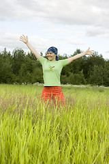 Image showing The girl in a grass