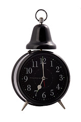 Image showing black alarm clock on a white background. 