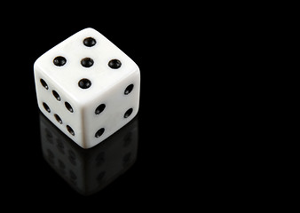 Image showing White dice on black background