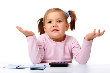 Image showing Little girl with few paper euro banknotes