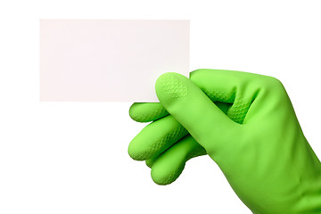 Image showing Hand in green glove showing business card