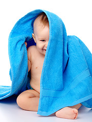 Image showing Cute child wrapped in blue towel