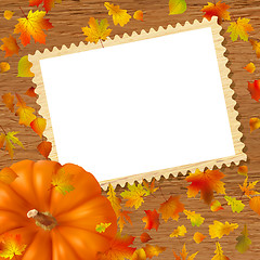 Image showing Pumpkins and leaves on frame.