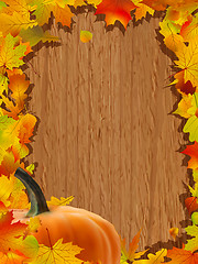 Image showing Autumn background with Pumpkin on wooden board.