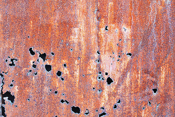 Image showing Rusty steel sheet with holes