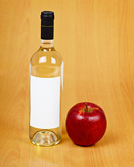 Image showing Bottle of cider on wooden table