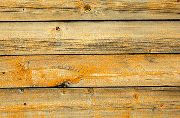 Image showing Old battered wall are covered with boards