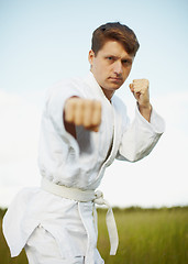 Image showing Ðoung man is engaged in karate