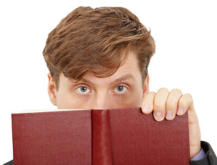 Image showing Person looks over the book