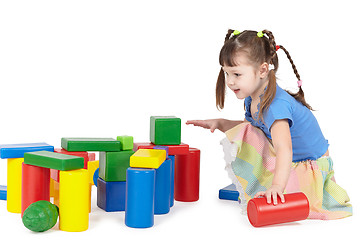 Image showing Girl playing with color toys