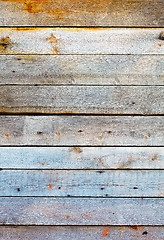 Image showing Wall covered with wooden planks