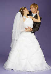 Image showing Bride and groom on purple background