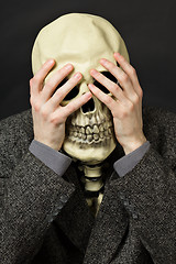 Image showing Skeleton covering his eyes