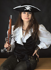 Image showing Young beautiful girl - sea pirate with pistol