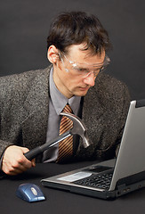 Image showing Person repairs laptop as is able