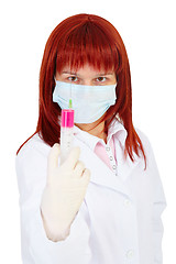 Image showing Young woman - doctor armed with large syringe