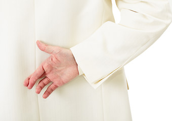 Image showing Businessman in white suit with crossed fingers