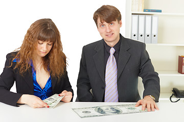 Image showing Man and woman have different wages