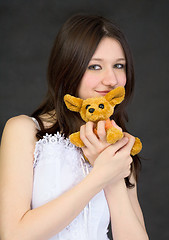 Image showing Portrait of teenage girl with favorite toy