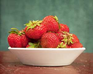 Image showing Ripe berries of strawberry in plate on table