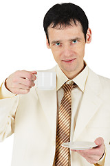 Image showing Man dressed in suit drinking tea on white background