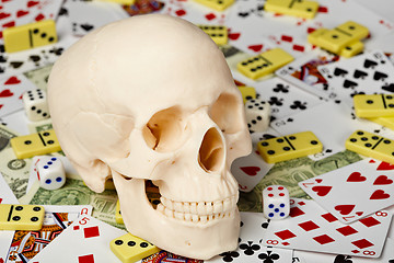 Image showing Skull on playing cards and money