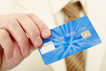 Image showing Businessman shows credit card