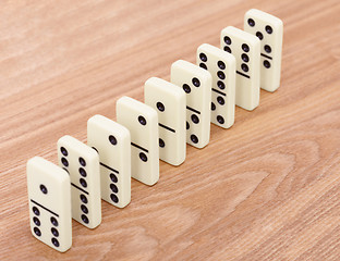 Image showing A row from dominoes