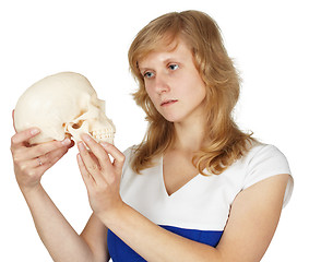 Image showing Student watches plastic human skull