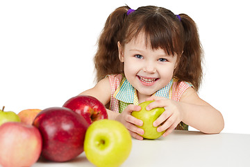 Image showing Happy child with apples - sources of vitamins