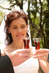 Image showing Glasses of wine with bride