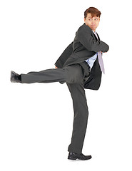 Image showing Businessman showing karate kick