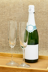 Image showing Bottle of sparkling wine and two wine glasses