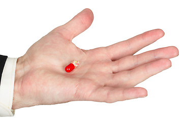 Image showing Hand with red pill, white background