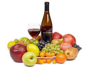 Image showing Bottle of wine and glass surrounded by fruit