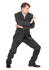 Image showing Businessman showing karate skills