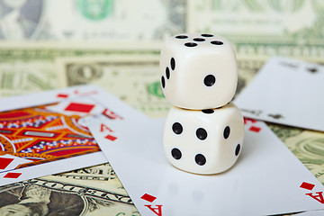 Image showing Pair of dice on background of cards and money