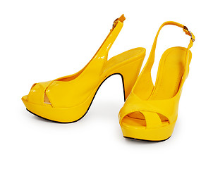 Image showing Pair of yellow female shoes isolated on white background