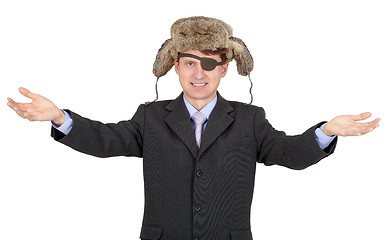 Image showing Portrait of young businessman with a eye-patch in fur hat