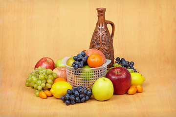 Image showing Still life of fruit and ceramic bottle