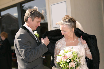 Image showing helping the bride